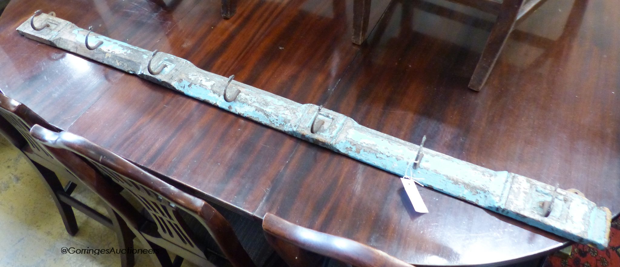 A provincial painted wood Continental coat rack, length 152cm